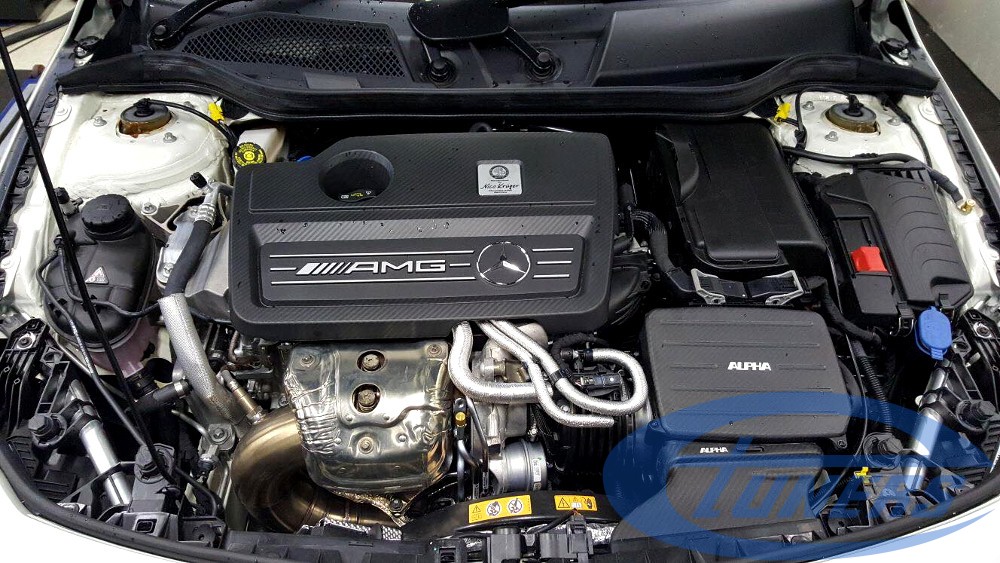 Mercedes CLA45 AMG 2.0T - The Alpha intake kit and upgraded downpipe are visible in the engine bay